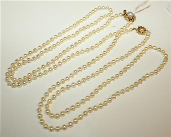 Two single row pearl necklaces, each with gold & pearl-set flowerhead clasp